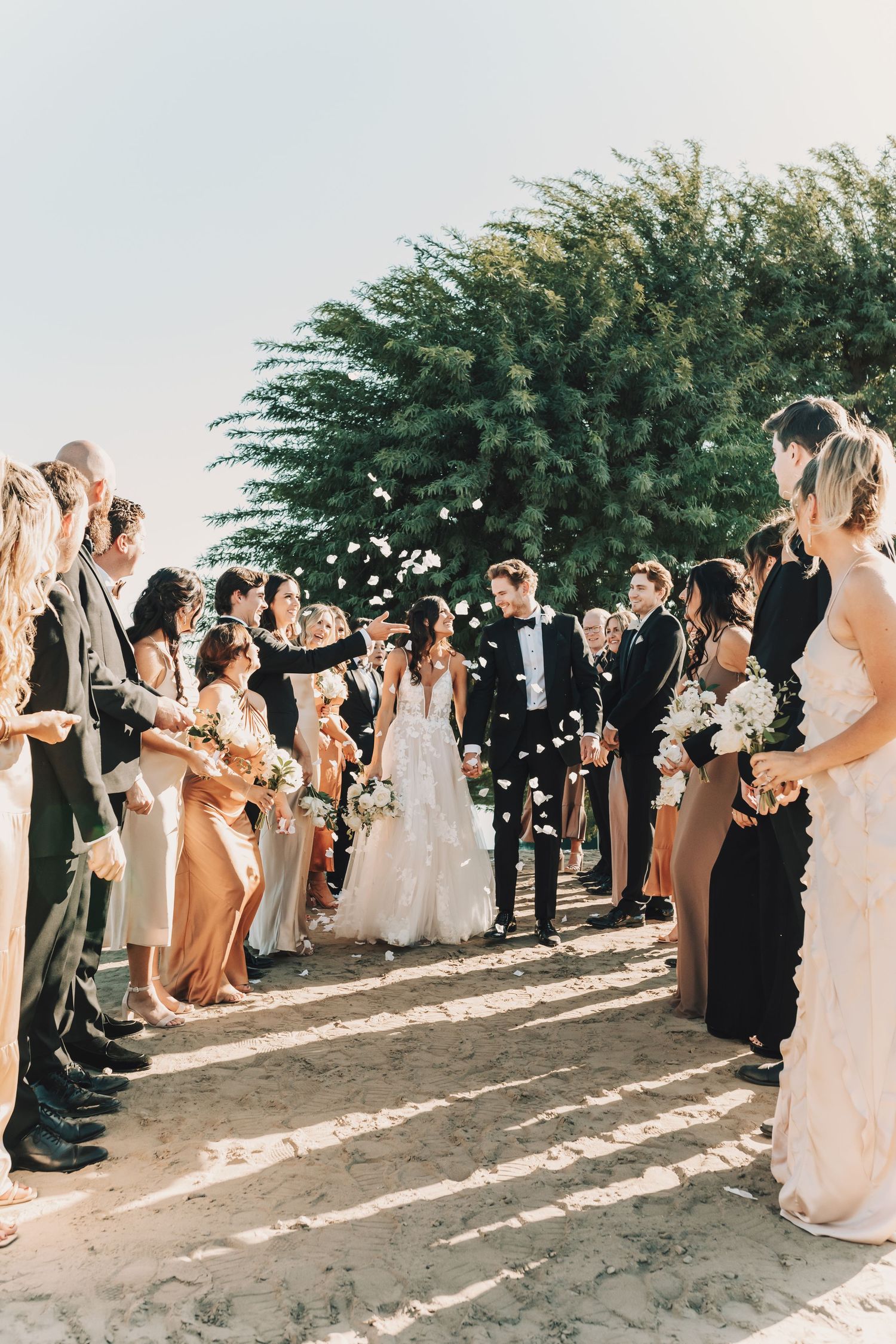 Bride and groom in a boat on lake during romantic wedding session in Southern California by Bethany Jean Photography.