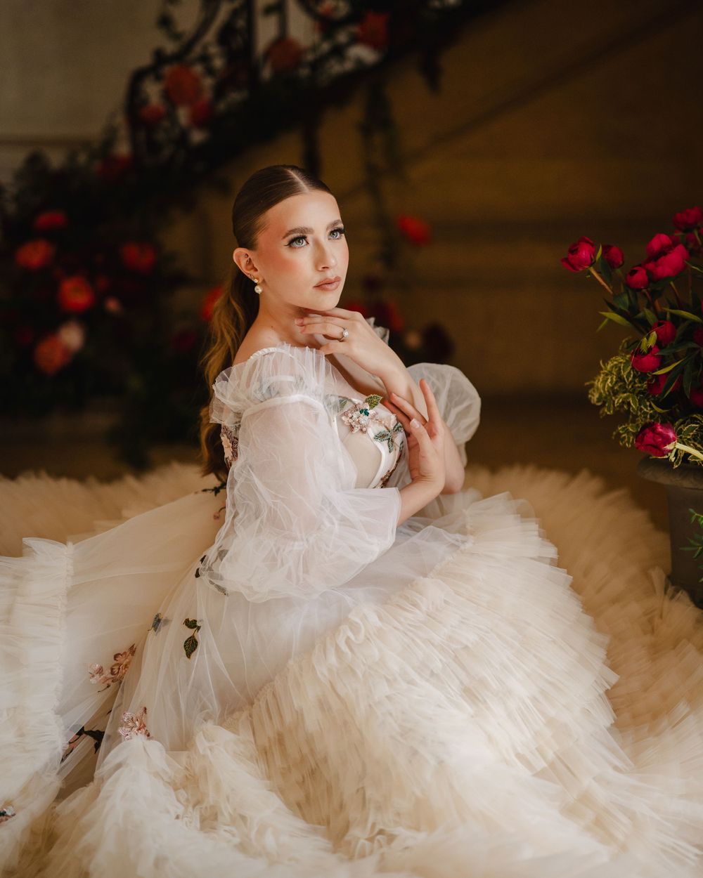 Romantic bridal portrait featuring an ethereal white gown with delicate lace details.
