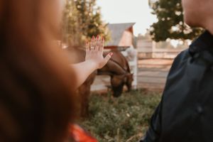 Intimate outdoor portrait session with couple in casual attire at sunset.