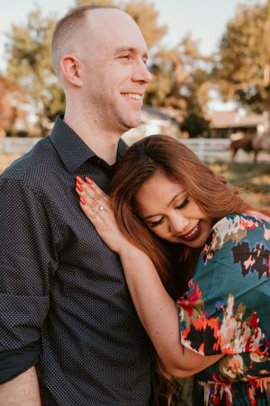 Tender embrace captured in series of romantic sunset photos outdoors.