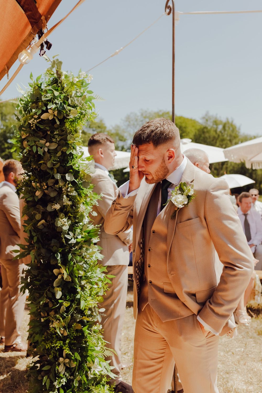 Groom waiting for his bride before the ceremony at an outdoor wedding in Romsey.