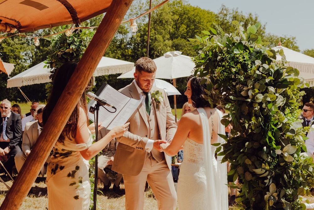 Amy and James sharing a quiet moment together during their wedding ceremony.