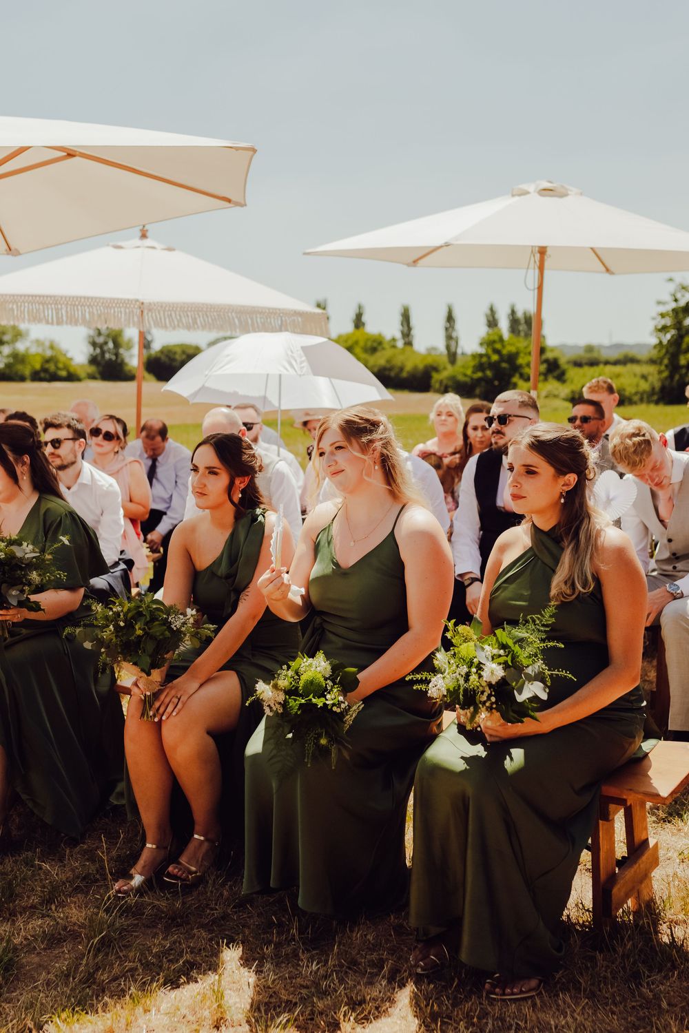 Guests watching the ceremony from the bride’s side at a field wedding in Romsey.