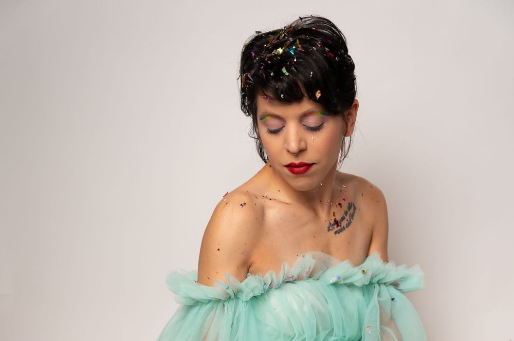 Elegant portrait series in mint green tulle with glitter accents.