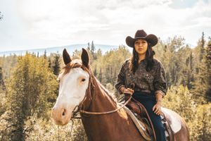 Equestrian portrait of a horse and rider in formal attire in Northern BC
