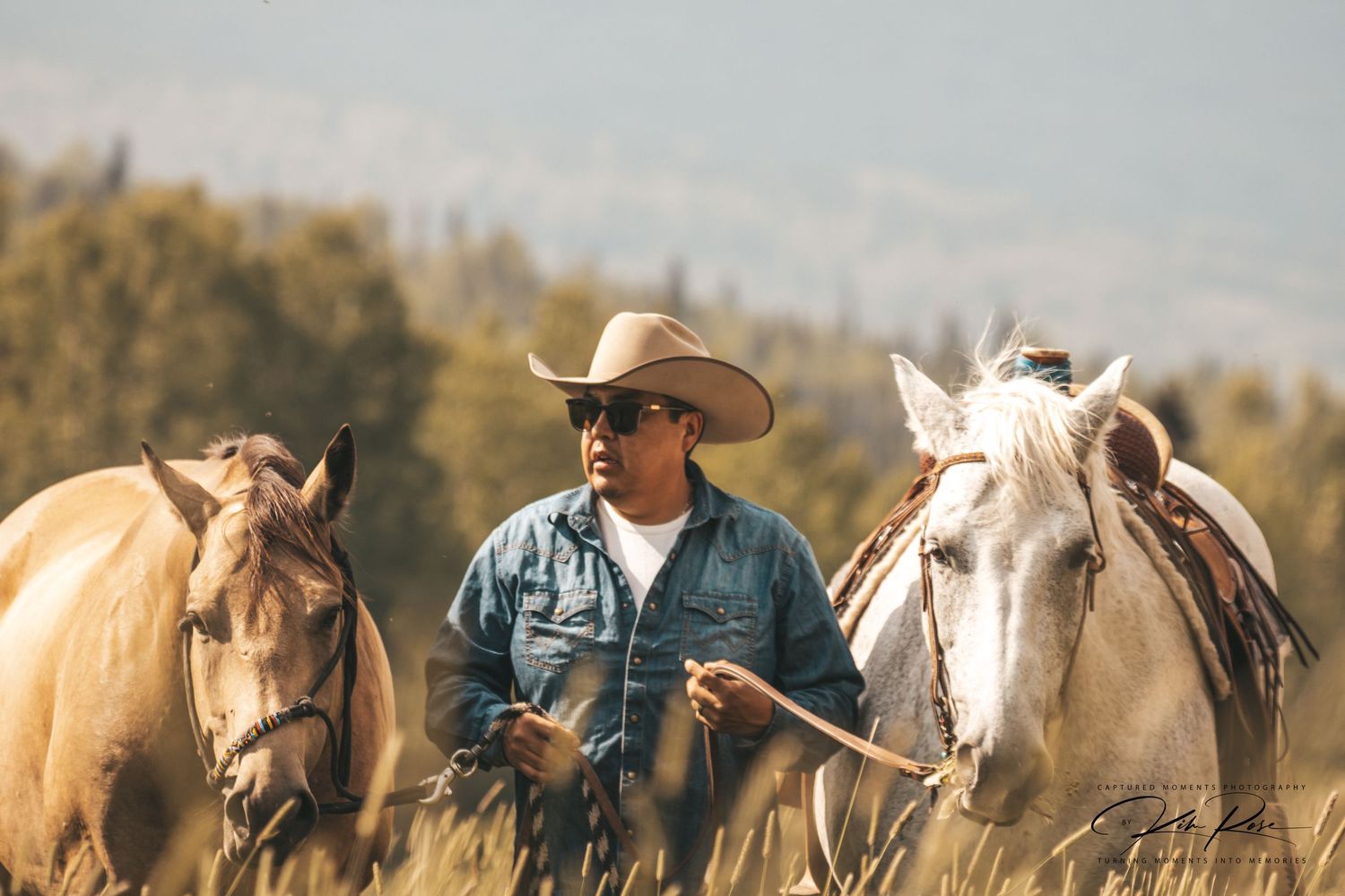 Rider preparing horse for a trail ride in Northern BC's forests.