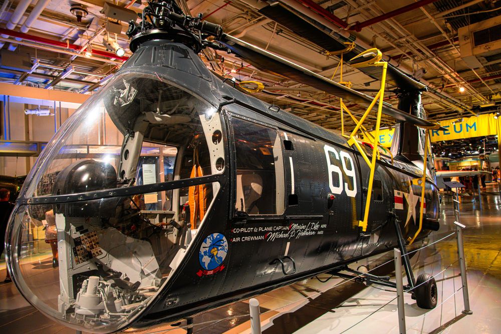 Navy helicopter with number 69 displayed in an aviation museum exhibit.