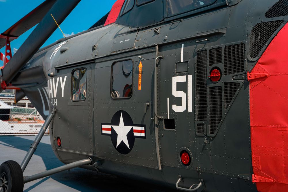 Navy helicopter fuselage displaying number 51 and military markings.