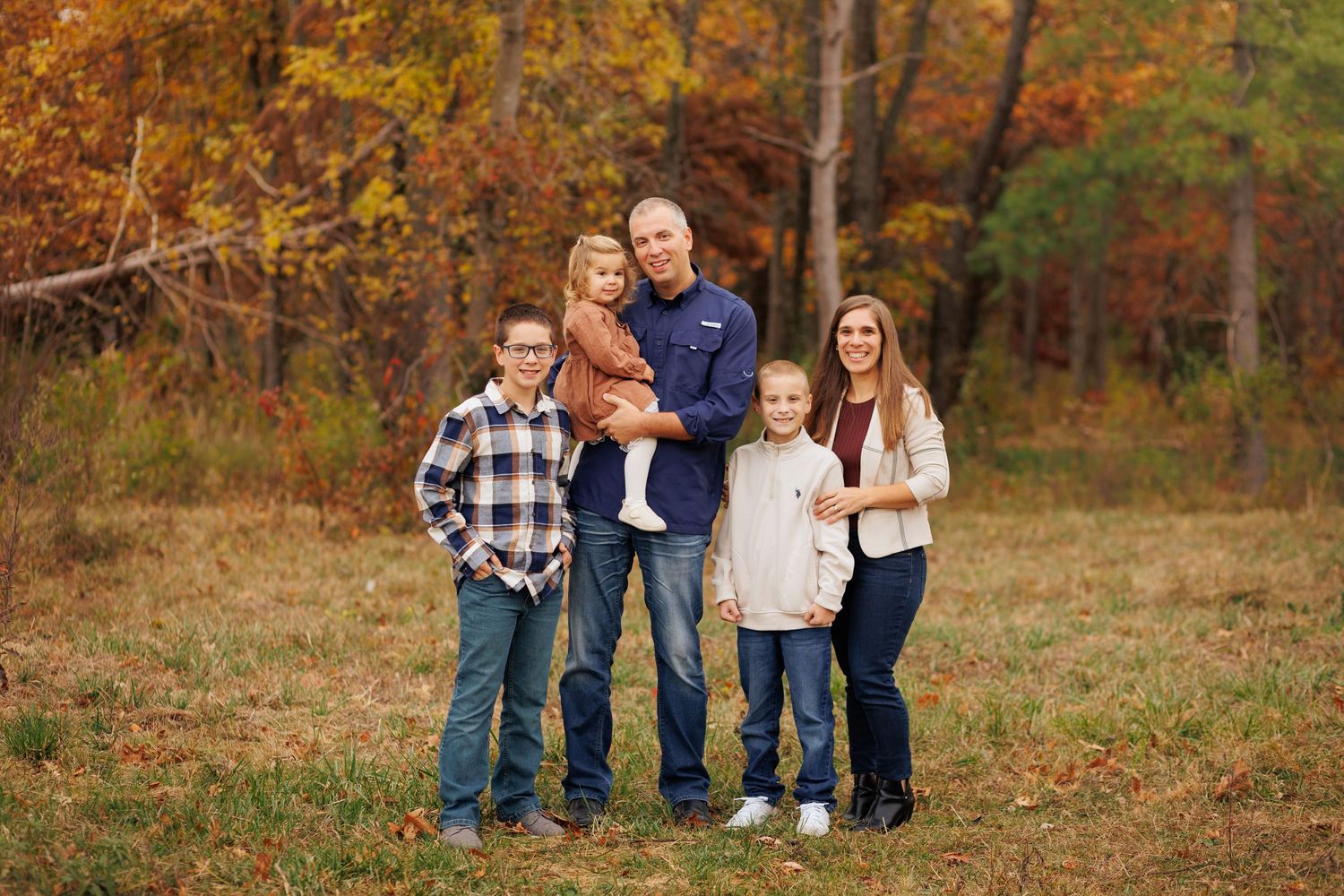 A small family poses prettily on a path outside of Mattoon, Illinois.