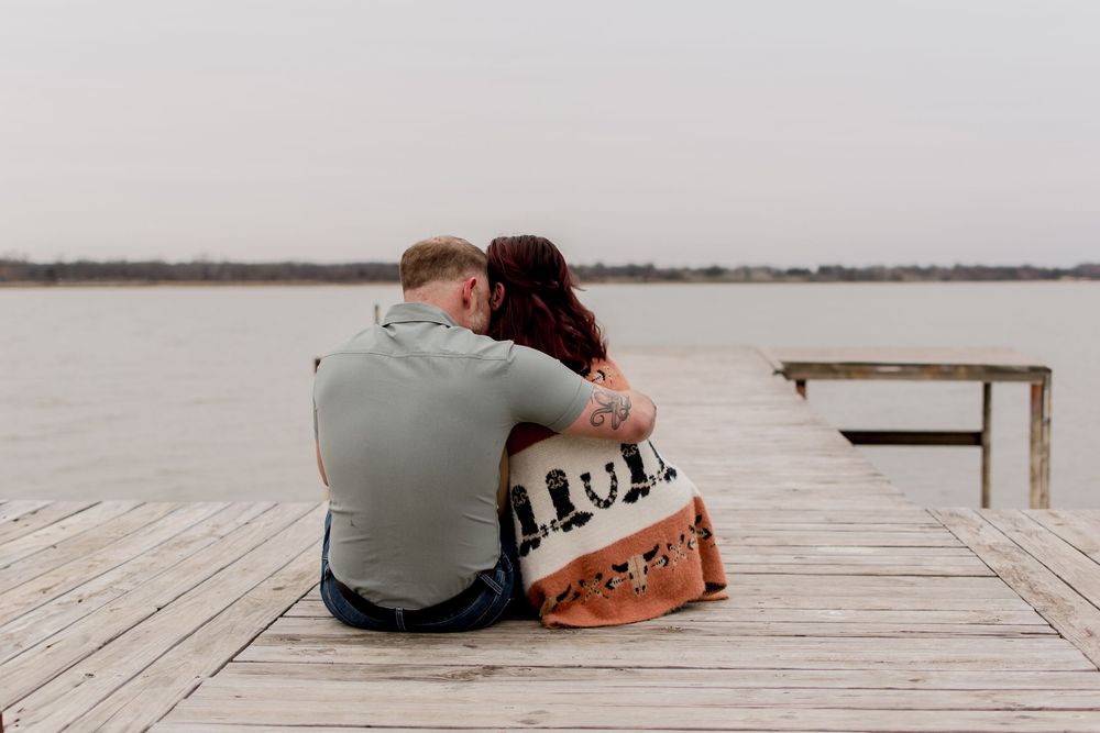 Lifestyle couples session at Eagle Mountain Lake in DFW metroplex embracing each other in the moment