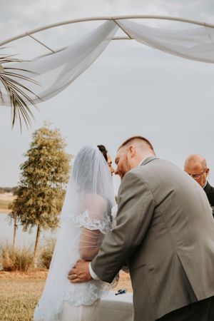 Romantic wedding ceremony moments photographed in warm autumn light.