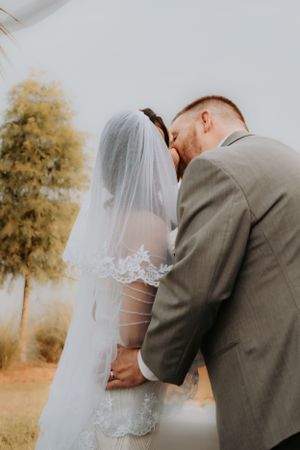 Intimate wedding ceremony moments captured against a soft autumn backdrop.