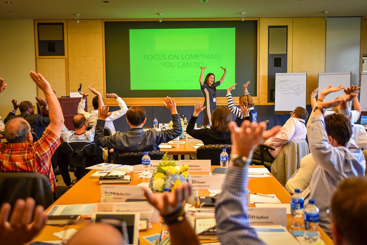 people raising hands at conference HIGHER EDUCATION PHOTOGRAPHER, UNIVERSITY PHOTOGRAPHER