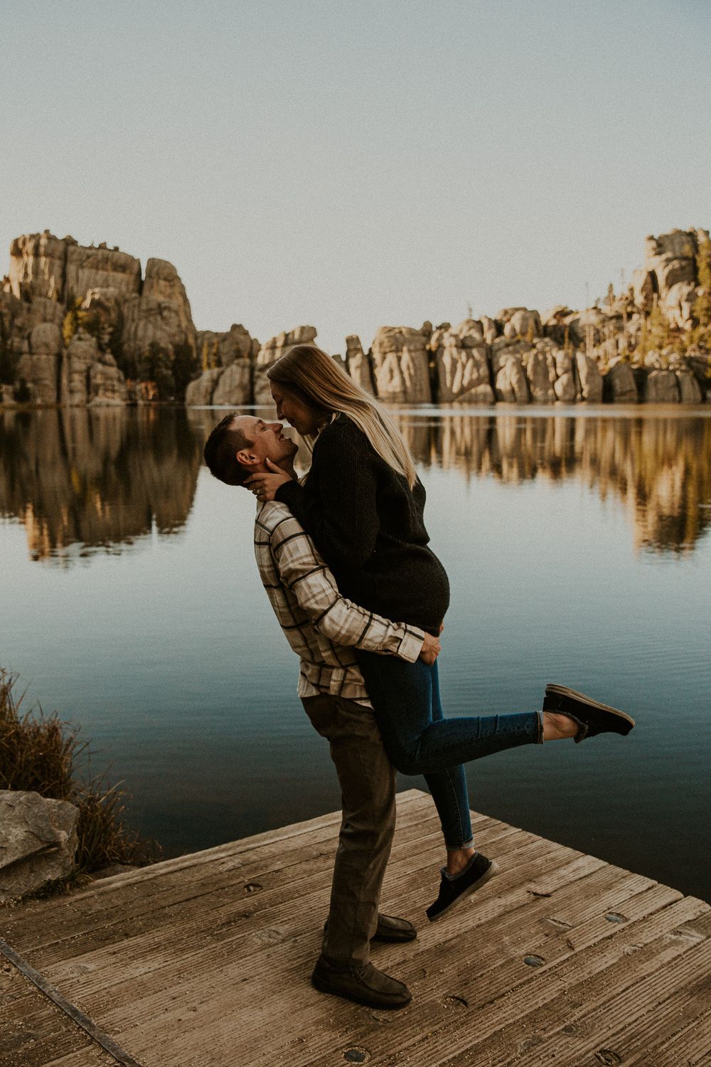 Couple Looking Lovingly at One Another During Sylvan Lake Engagement Session