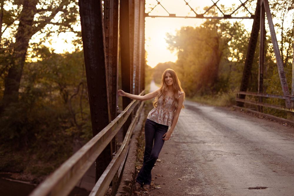 The Effingham high school senior poses on a bridge at sunset.