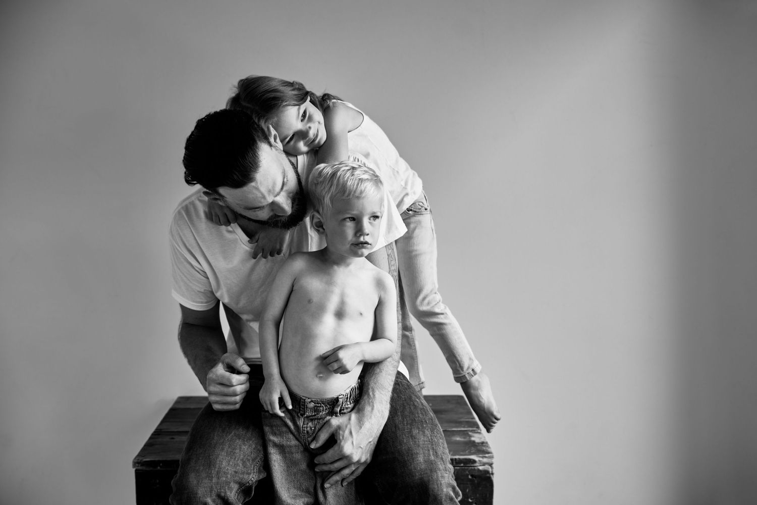 Tender black and white portrait showing parent and child moment.