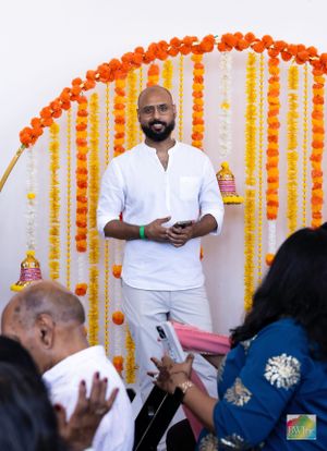 Event space decorated with orange and yellow marigold garlands in traditional Indian style.