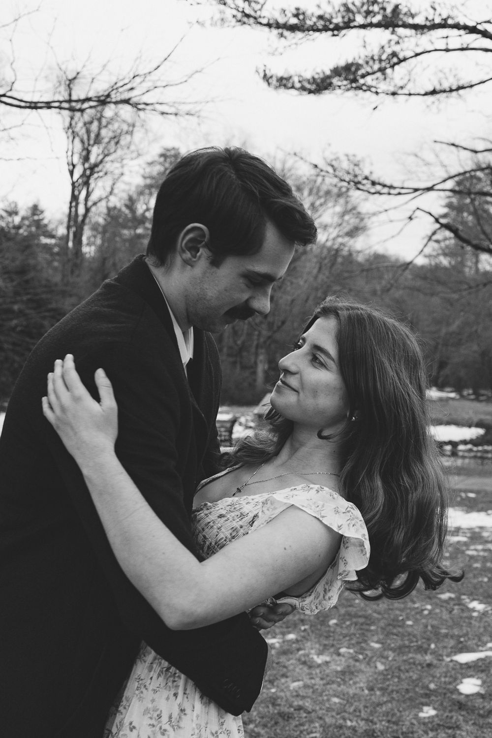 A romantic couple shares intimate kisses in a series of black and white outdoor photos. Castle  Ladyhawke Wedding Photographer