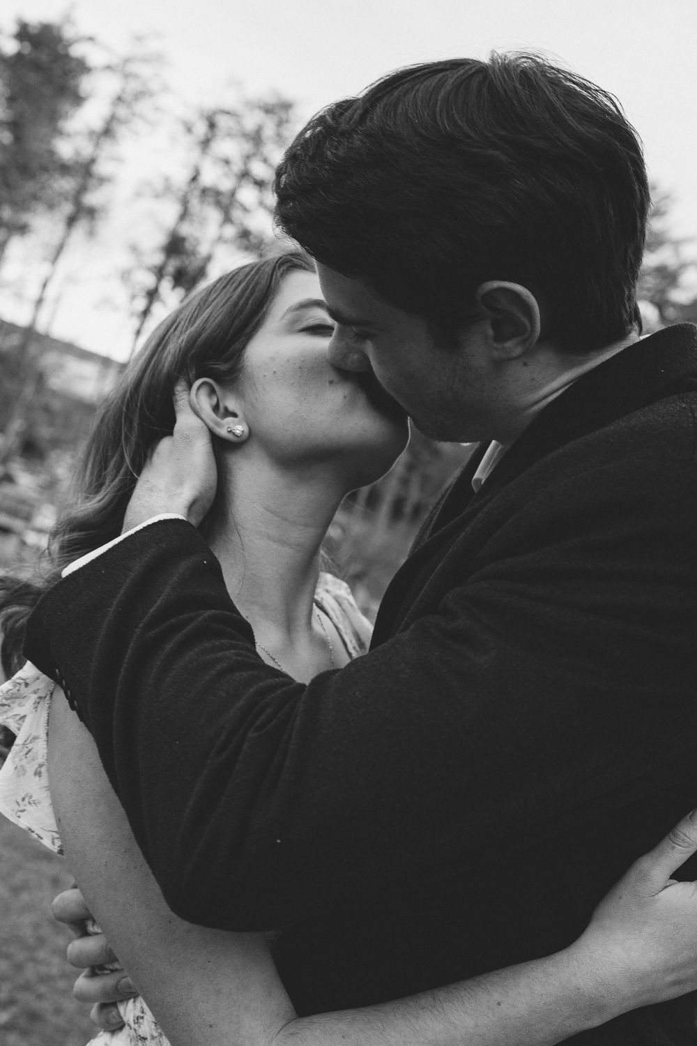 Black and white photos show a couple in a loving embrace outdoors. Castle  Ladyhawke Wedding Photographer