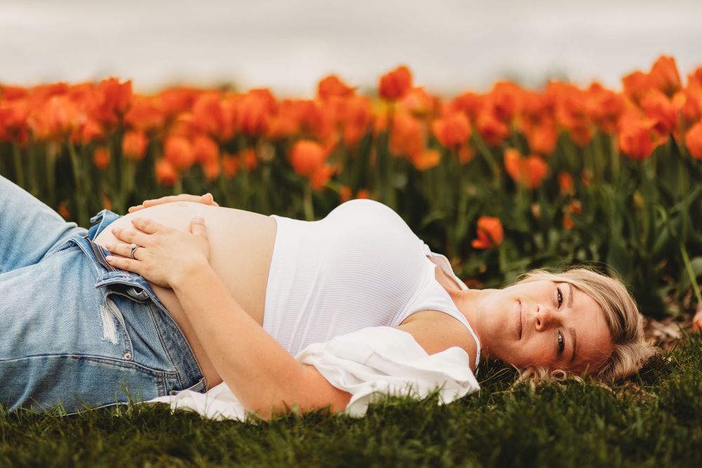 Maternity photo session taken in a tulip farm located in Belleville, Michigan
