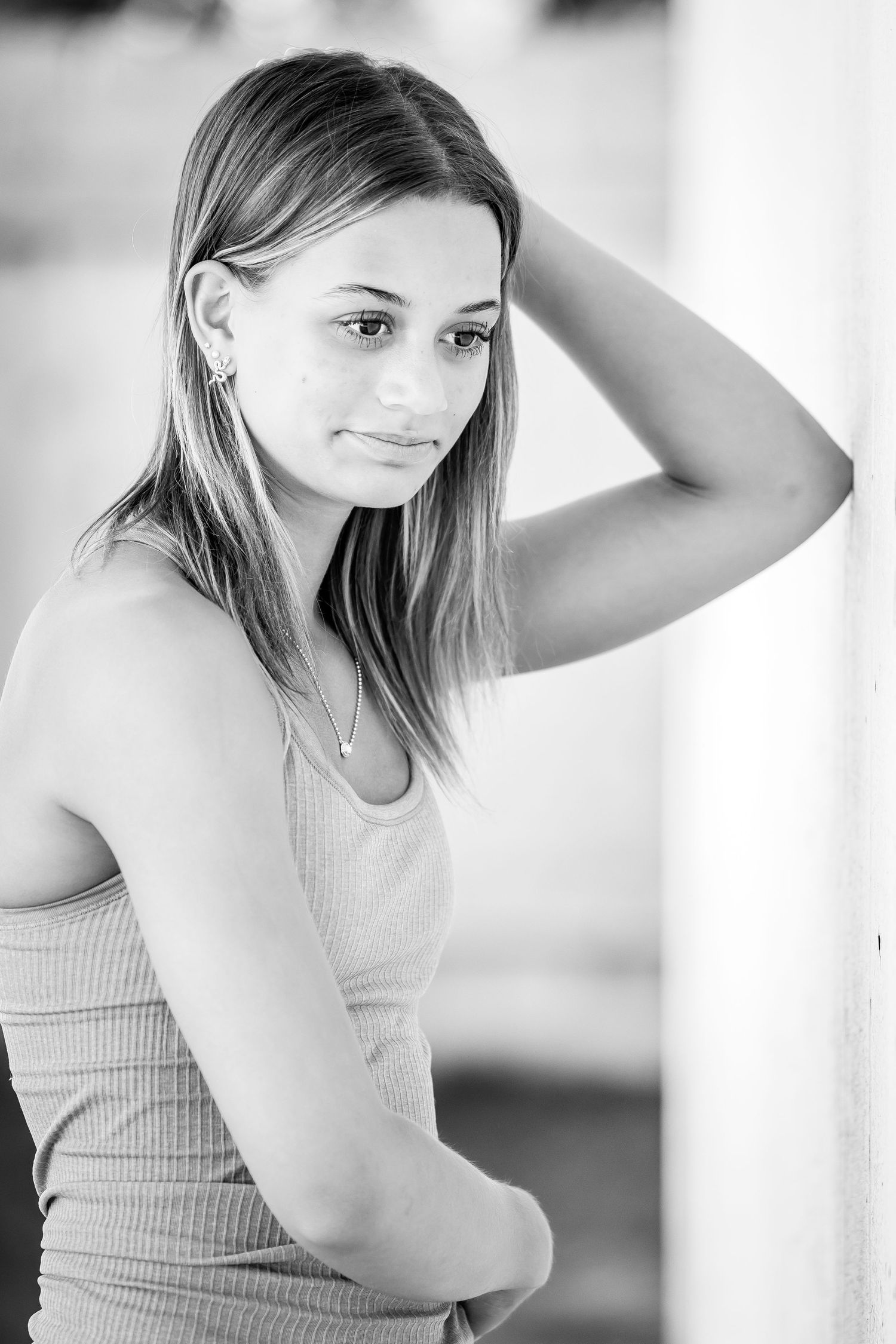 Black and white portrait series featuring artistic poses in natural lighting.