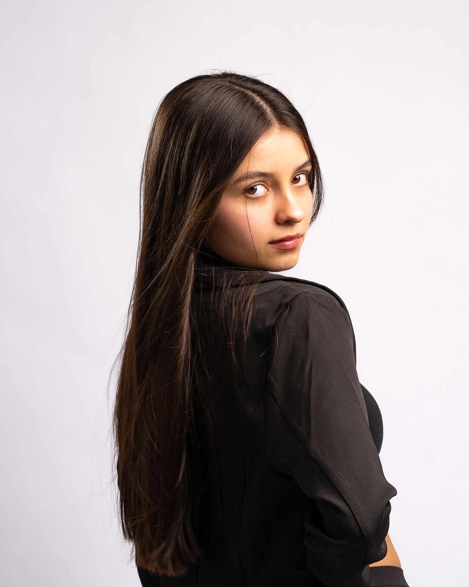 Young woman posing for a branding session in Logan, UT studio during their session. Taken with their local Cache Valley photographer.