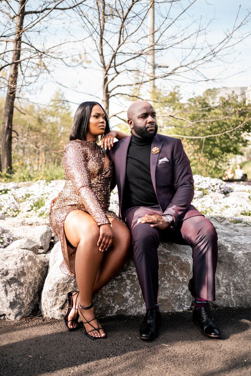 Couple Engagement at Dumbo, Man in Purple Suit, Woman in Sequin Dress Sitting on Rock