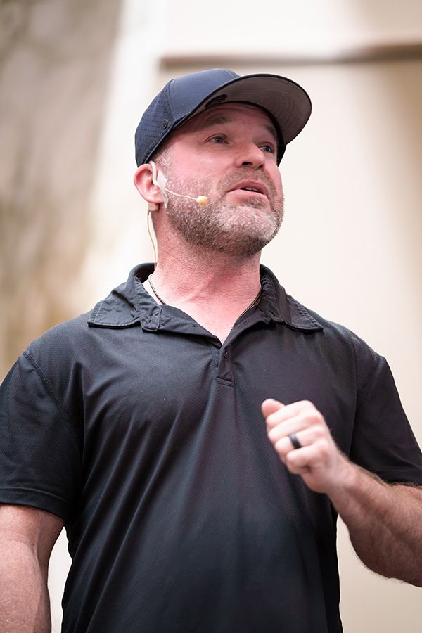 rise-up-live-event-speaker-stage-black-desert-speaking-resort-ivins-utah-guests-financial-teaching-badge-assembly-high-end-investments