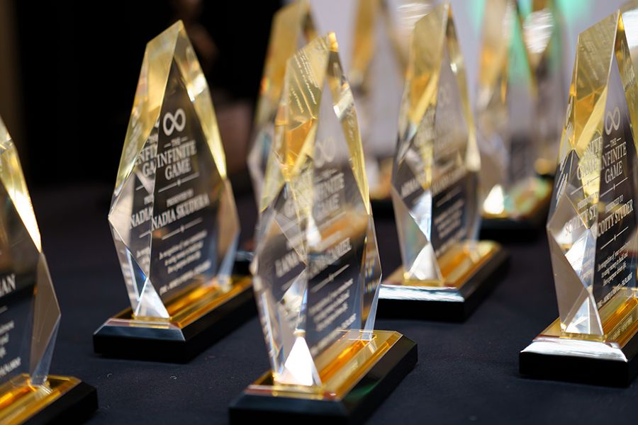 awards-ceremony-rise-up-live-event-speaker-stage-black-desert-speaking-resort-ivins-utah-guests-financial-teaching-badge-investments