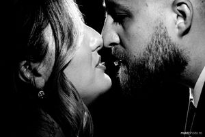 Romantic black and white close up photo of a couple about to kiss.
