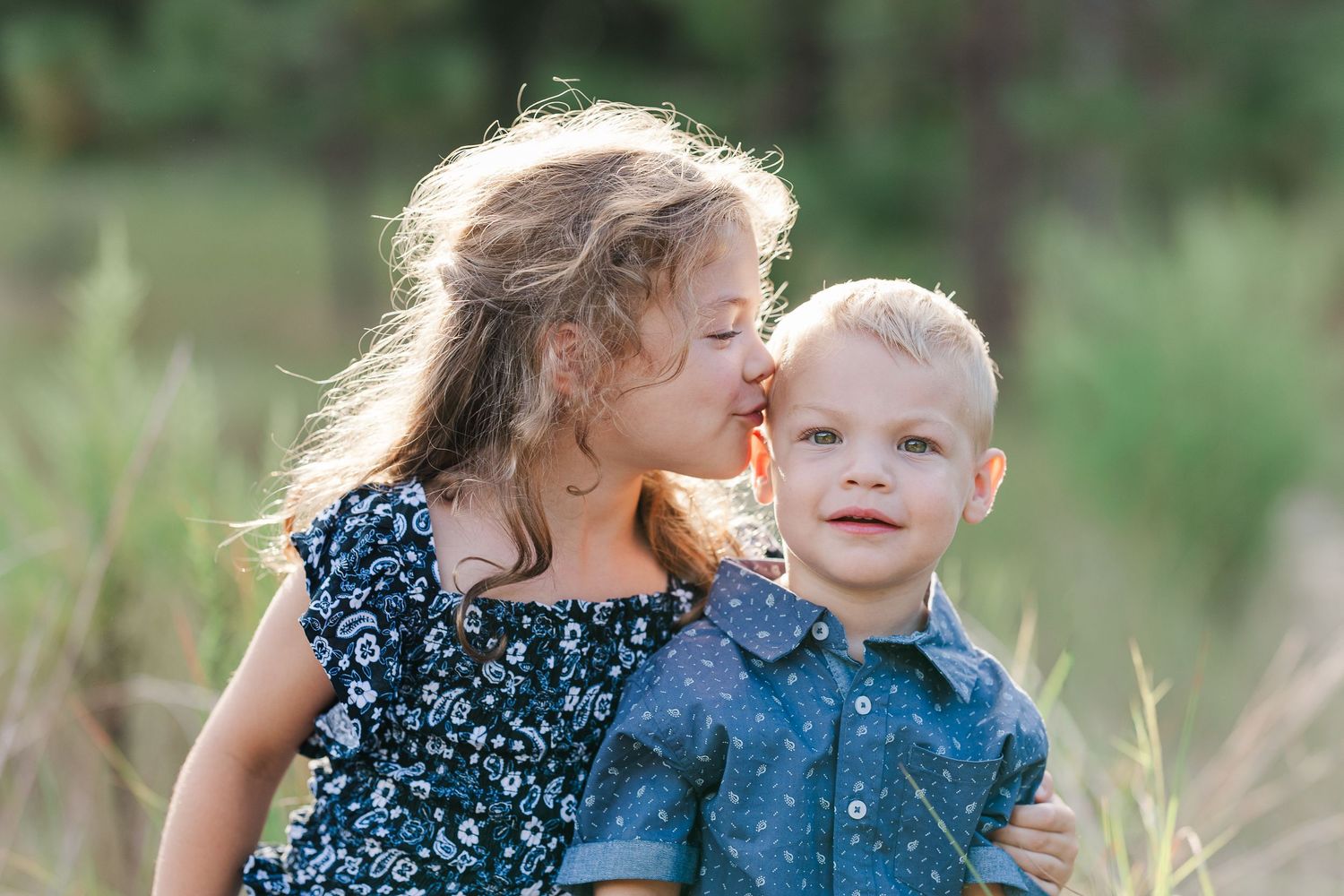 Sweet candid moments between parent and child in a natural outdoor setting.