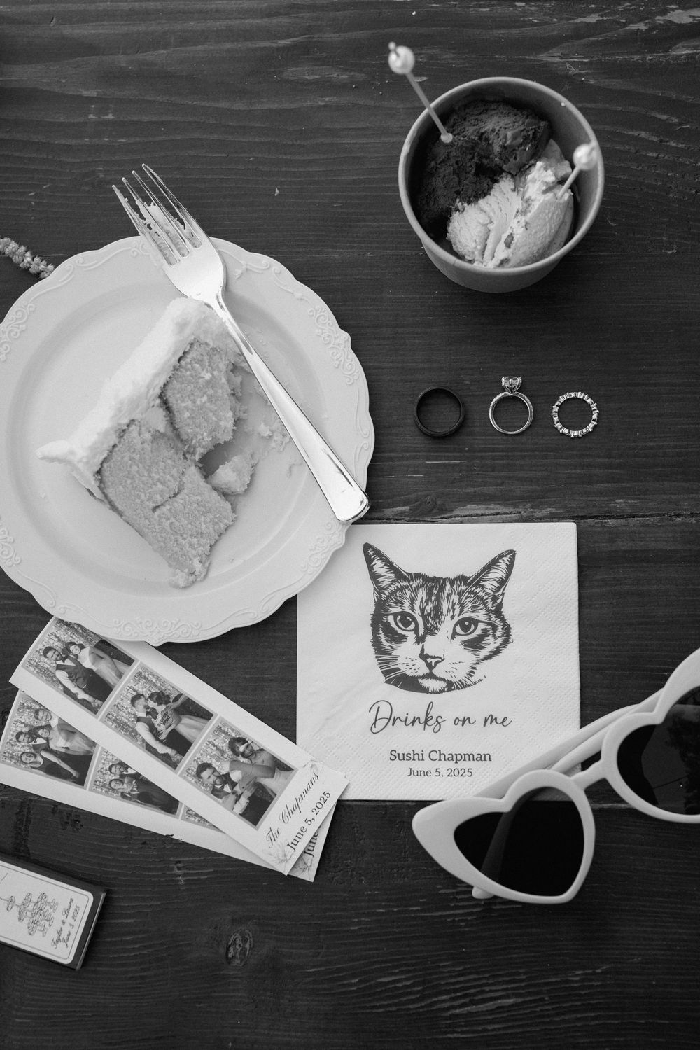 A black and white photo series showing a table setting with a cat drawing and meal plates arranged artistically.