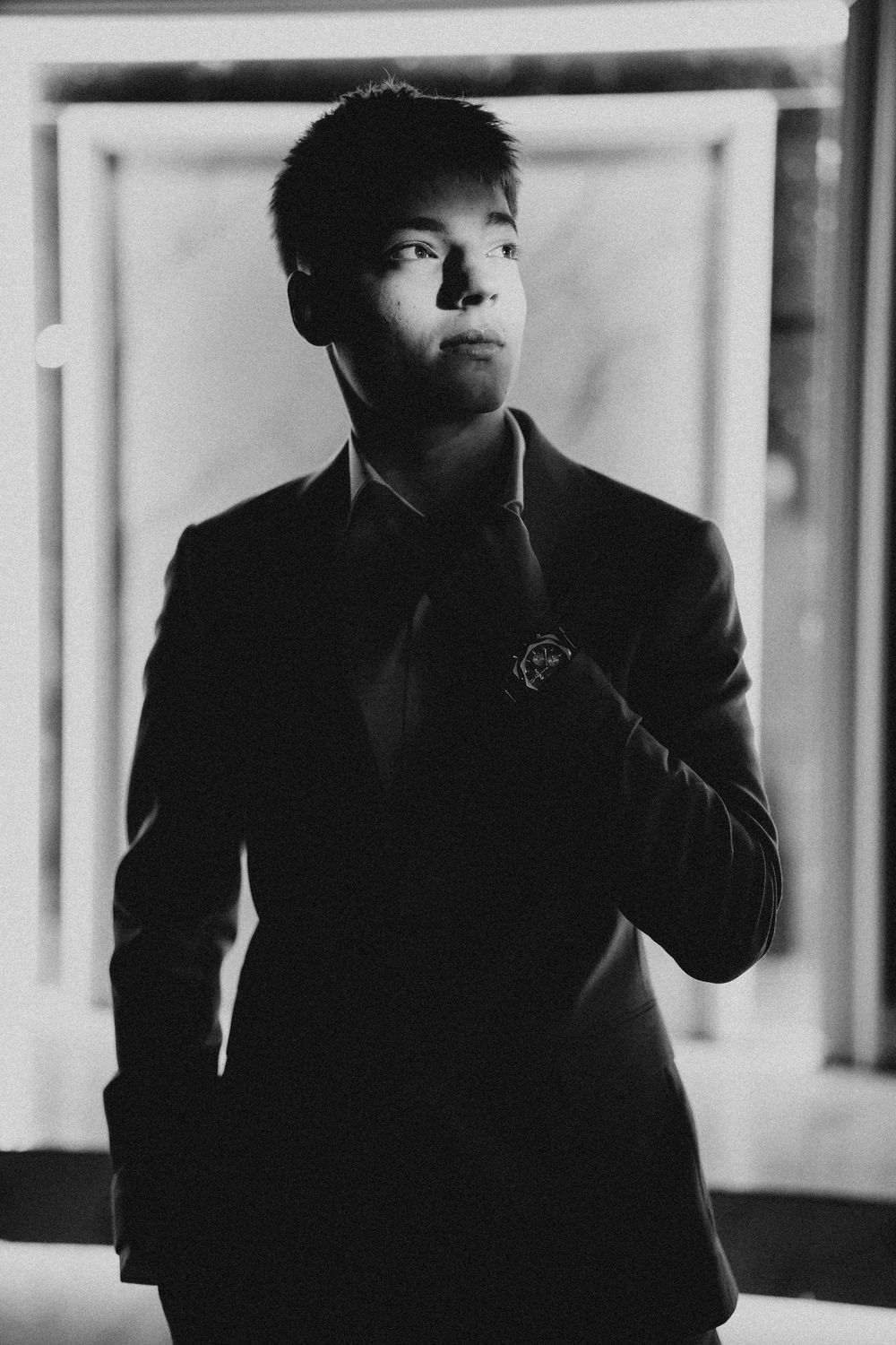 Black and white portrait series with artistic shadows and lighting.
