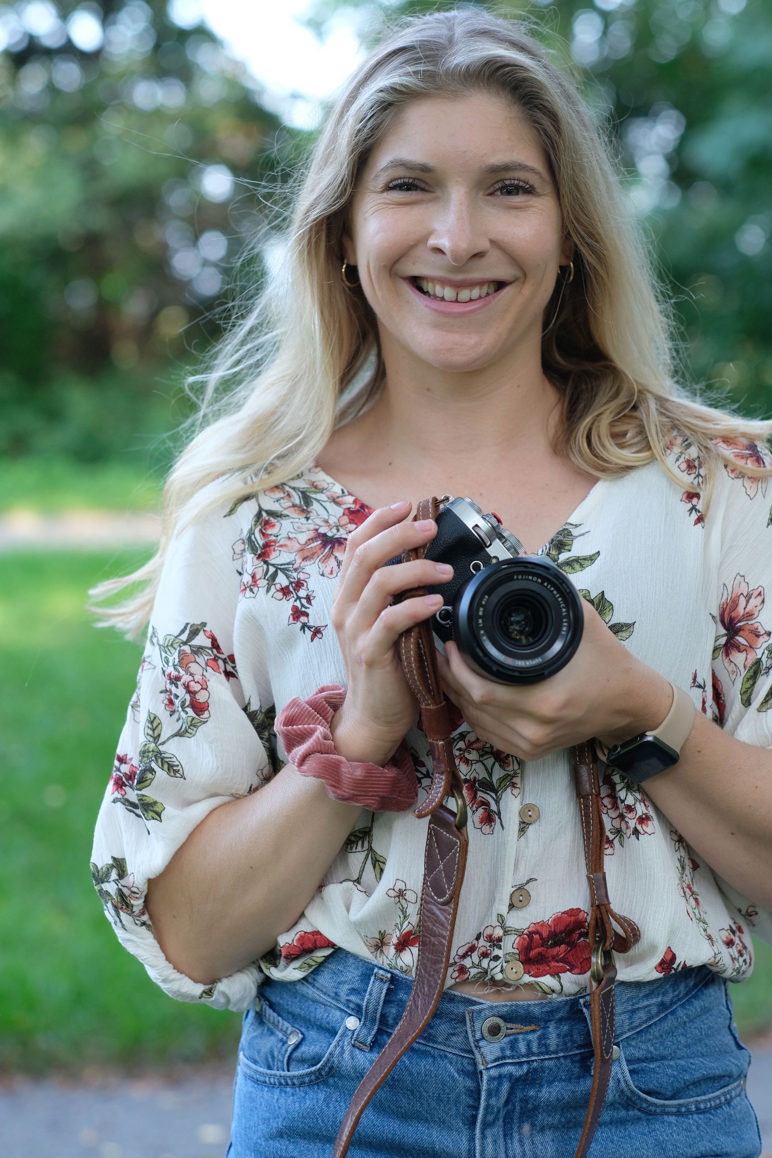 Professional photographer capturing a stunning portrait in natural light