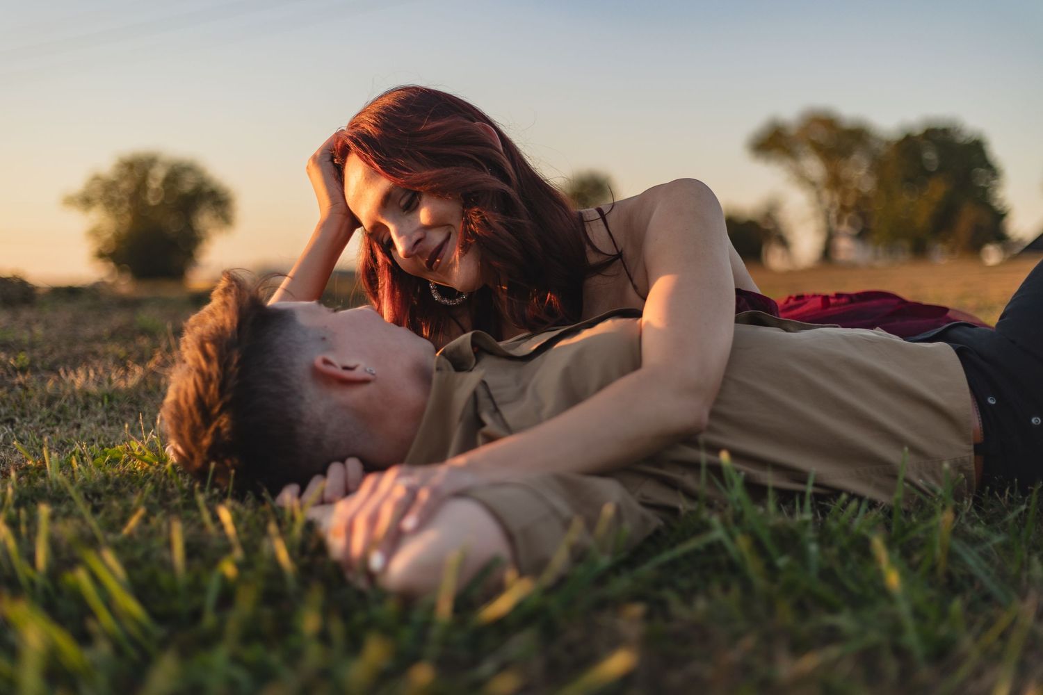 Classic Pontiac car serves as backdrop for romantic vintage-style portrait.