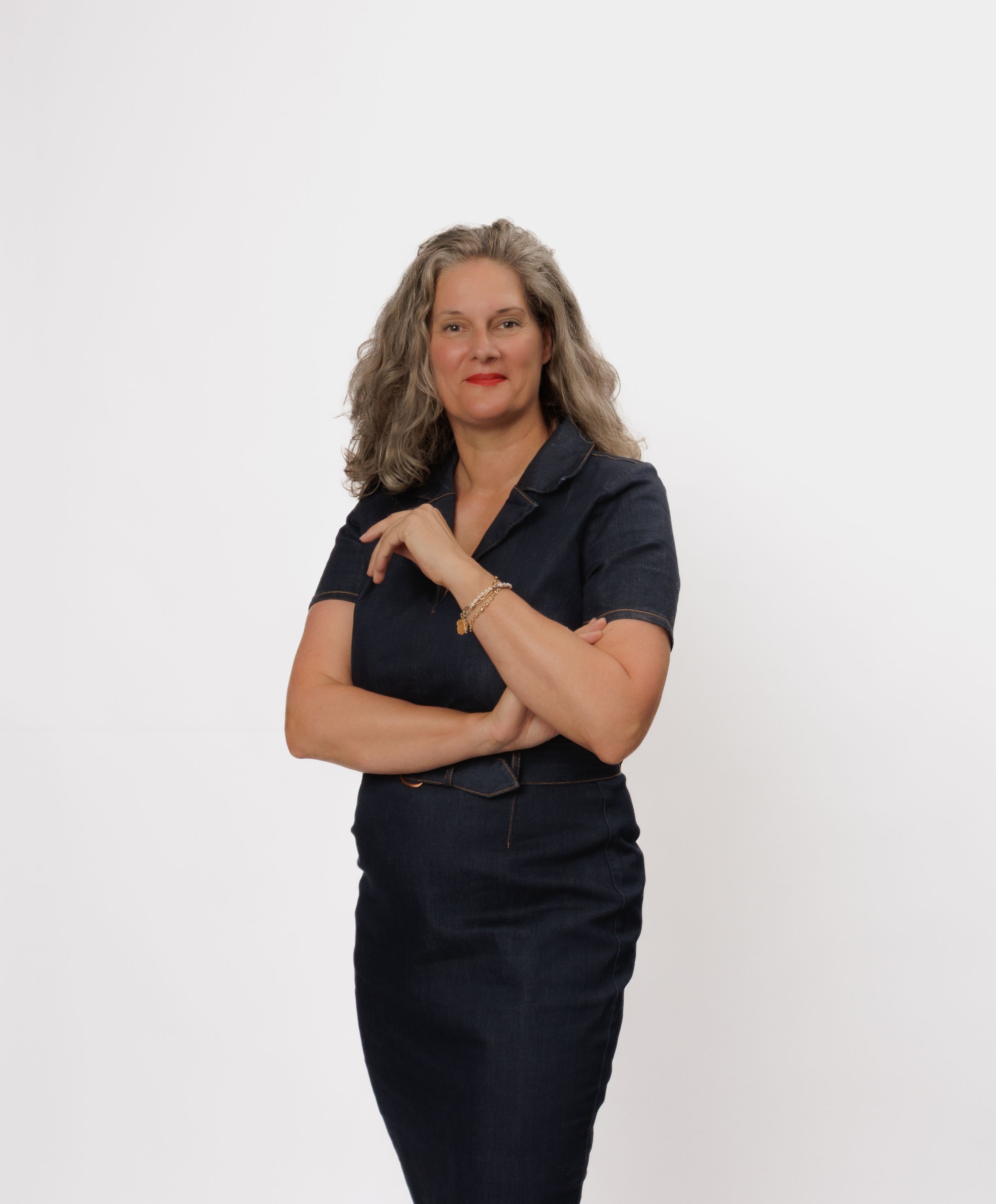 Woman in black top poses confidently against white background in three different casual stances.