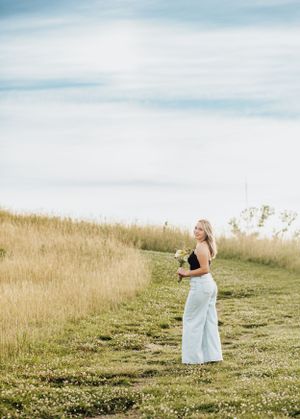 Summer senior session with wildflowers.