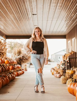 Fall senior session at pumpkin farm.