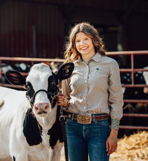 Senior session with a cow.