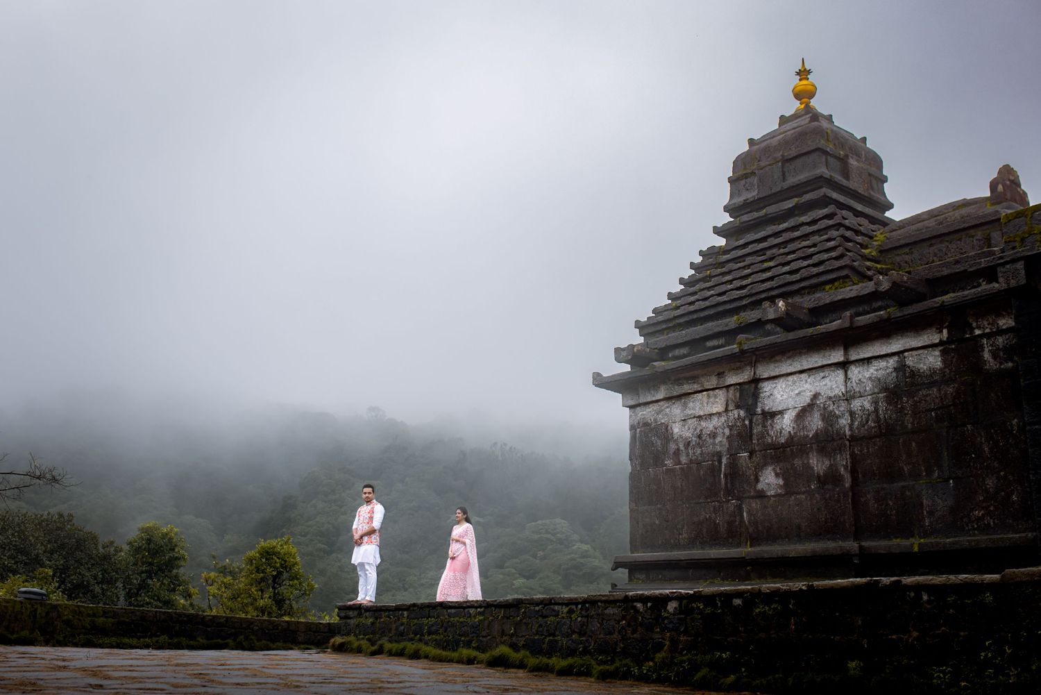 Misty mountain temple scene with traditional architecture and foggy backdrop.