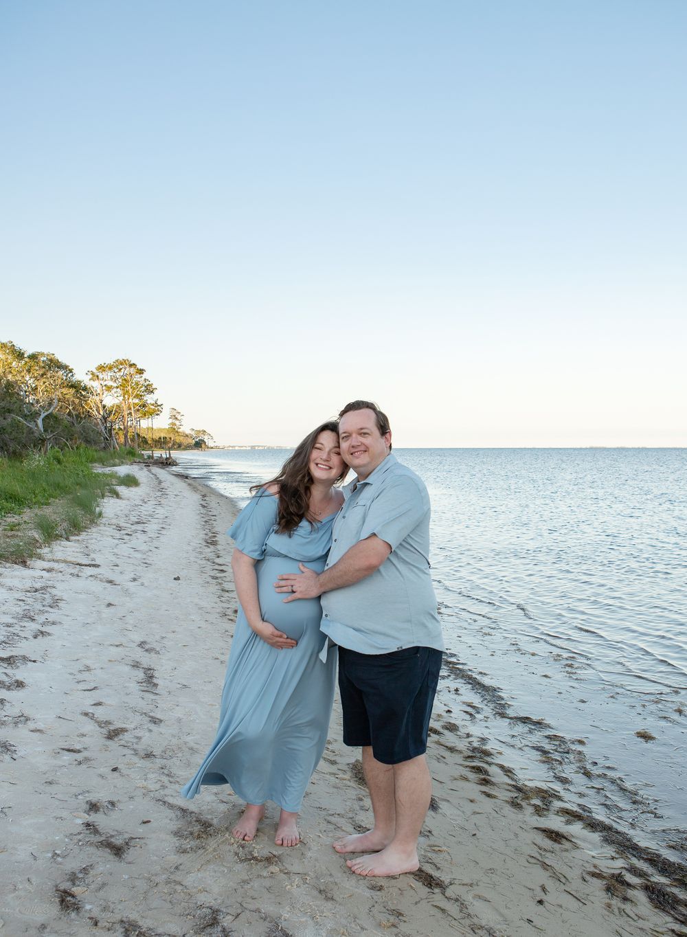 Gulf Breeze Florida intimate maternity photography session on the beach at blue hour with trees
