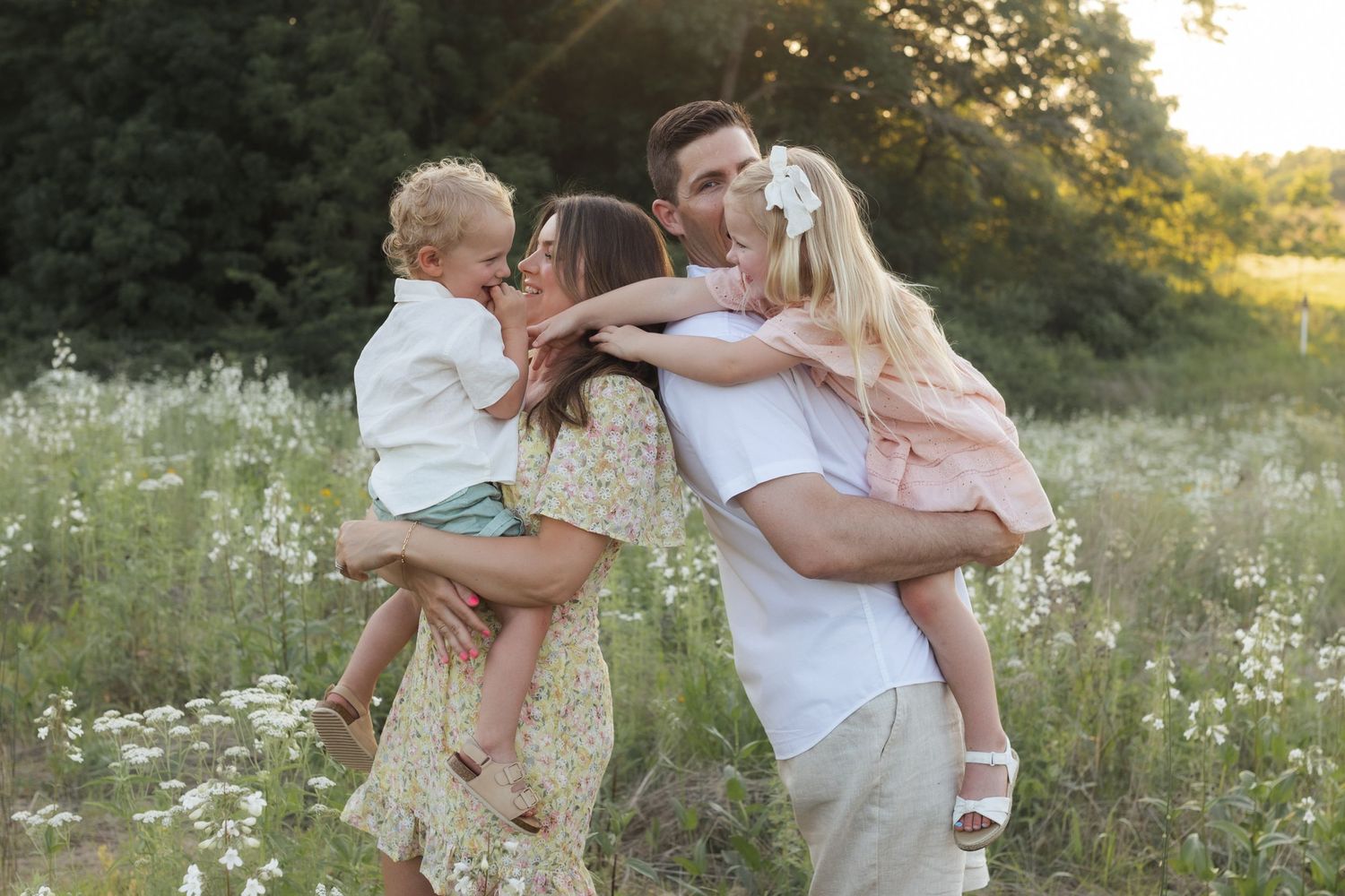 Family photos in a field of wildflowers in Columbia Missouri photographer