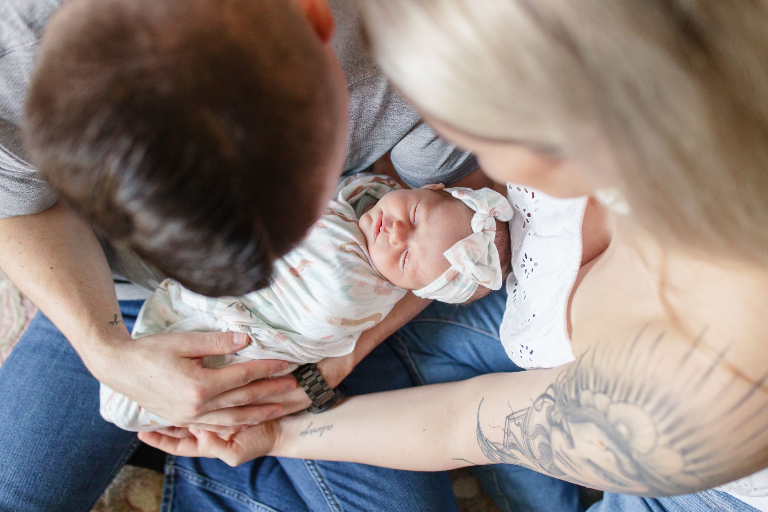 A person in a medical setting receives a vaccination shot in their upper arm.