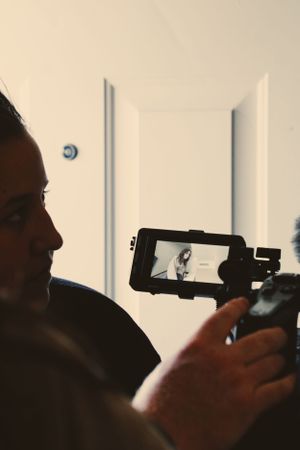 Close-up of camera viewfinder screen during a video production shoot.