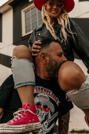 Pink sneakers and casual attire create a playful urban fashion contrast in this streetwear photo shoot.