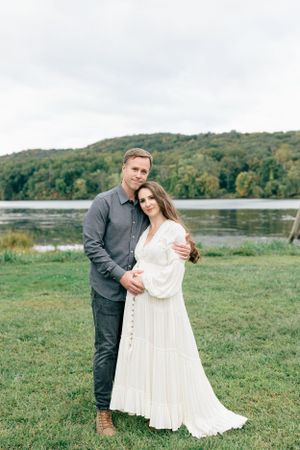 Pregnant mom with her husband in the meadow near Hartford | Connecticut Maternity Photographer.