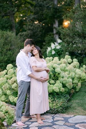 Couple snuggling with anticipation for their first baby | Connecticut Maternity Photographer..