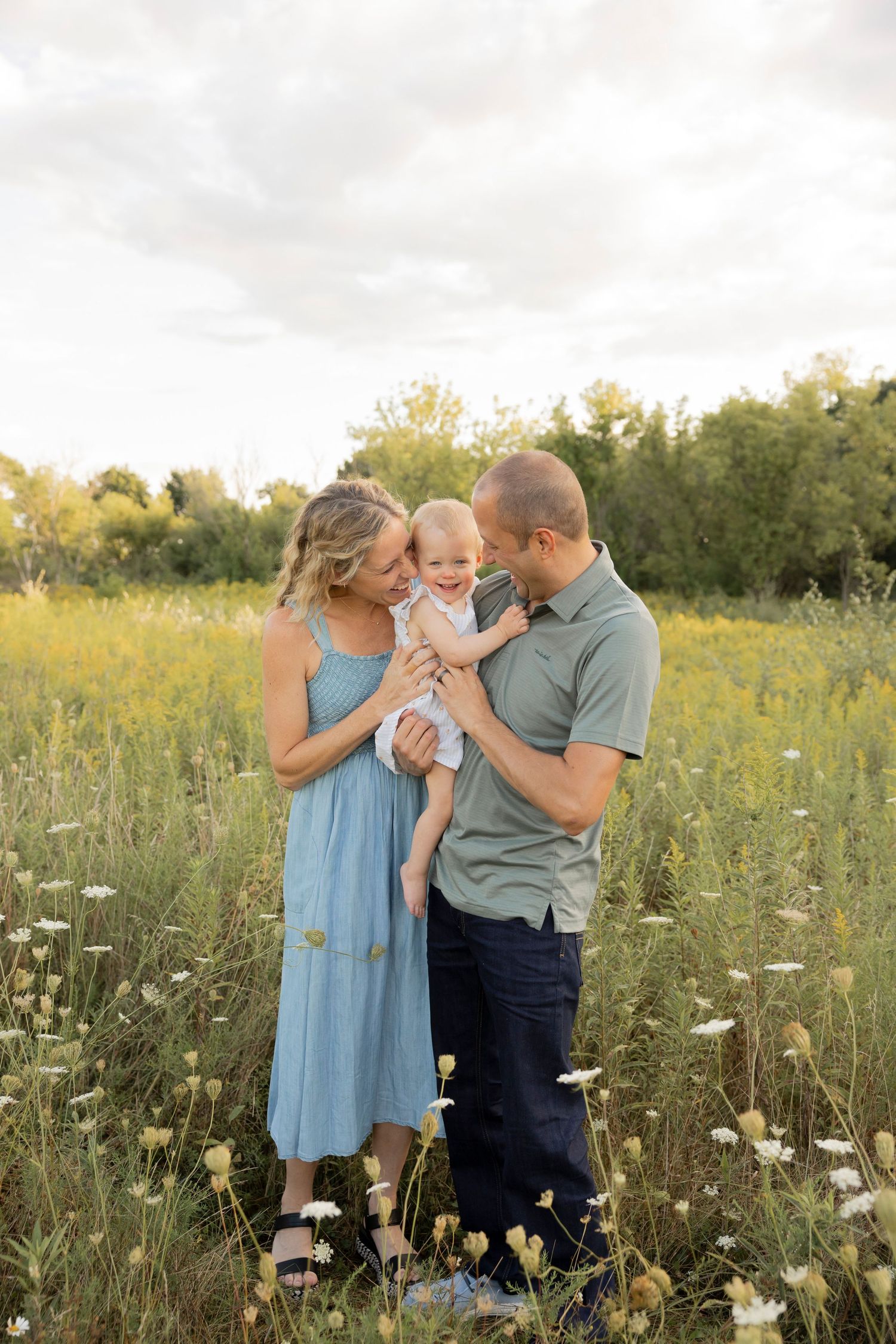 family with two toddlers smiling at each other for a photo at bear creek nature park