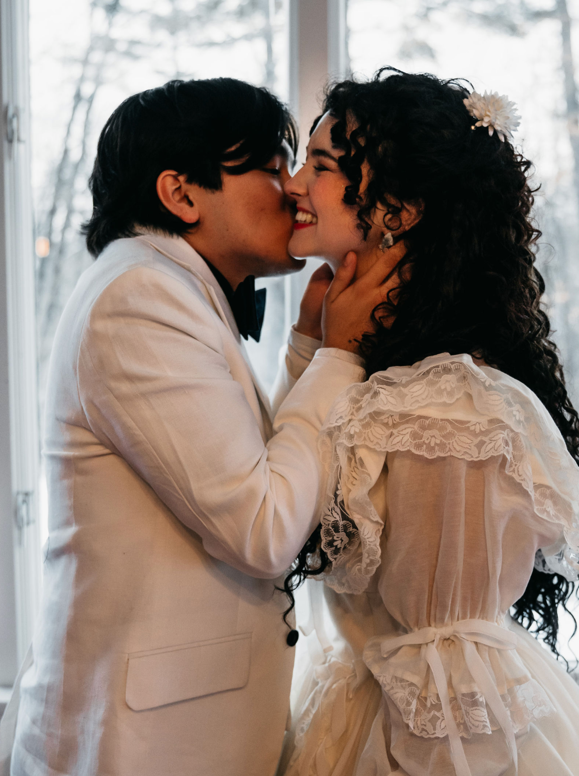 Sweet, happy winter wedding moment with bride and groom at the Hartness house in VT.