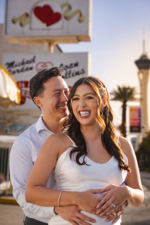 Little White Chapel elopement at sunset with the Las Vegas Stratosphere tower visible in the background.